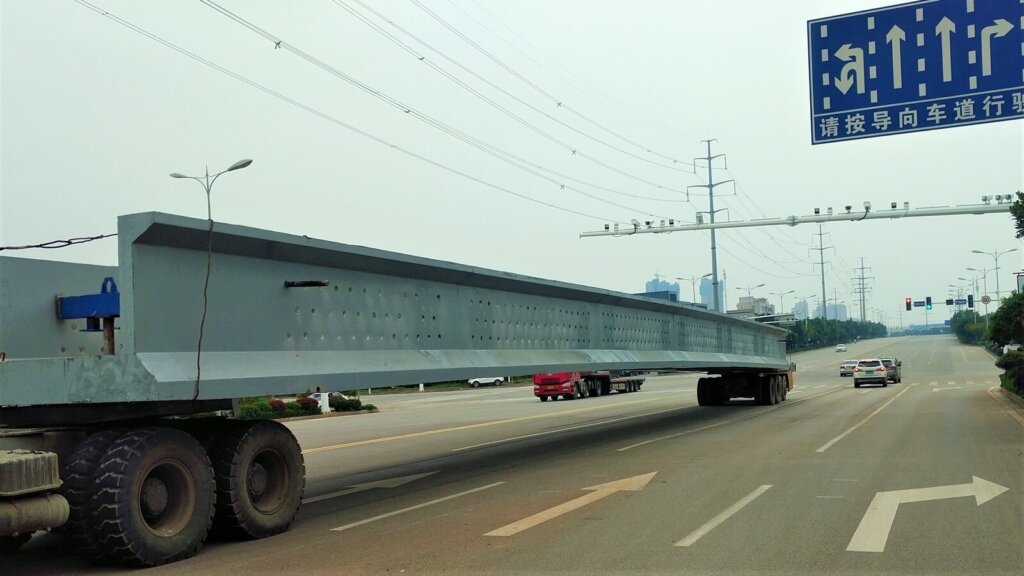 Transporting of U girder at a highway.