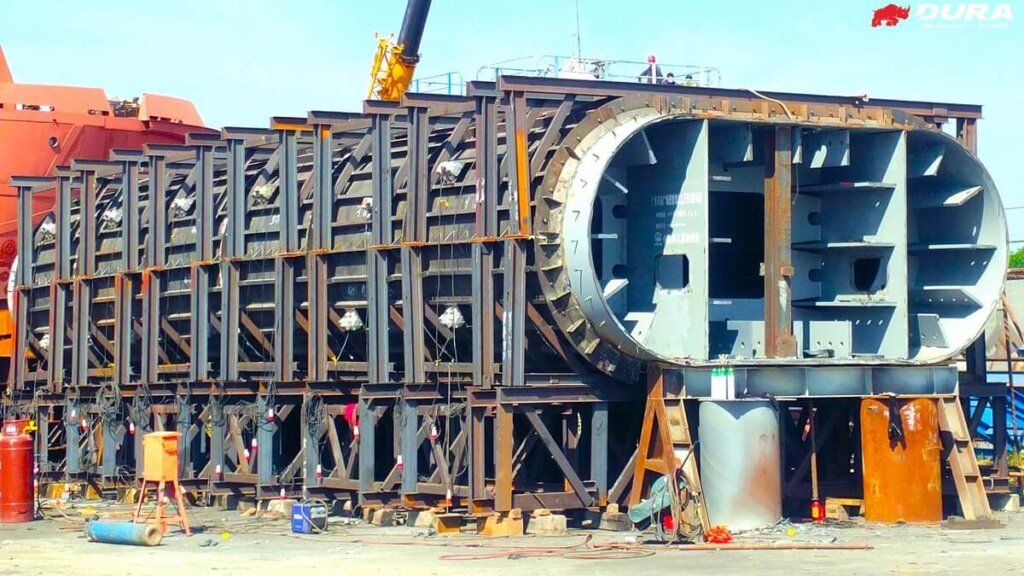 Casting of ZL-Dura UHPFRC jackting around the steel box.