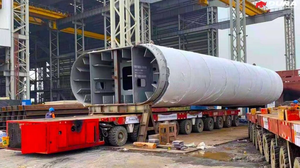 Transportation of UHPFRC composite arch leg for assembly.