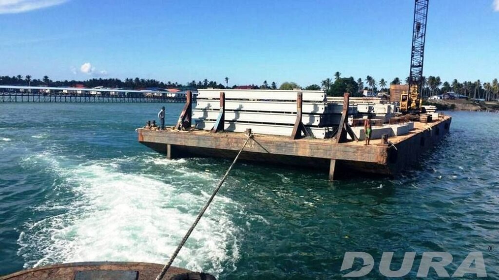 A tug boat towing the barge to a suitable location