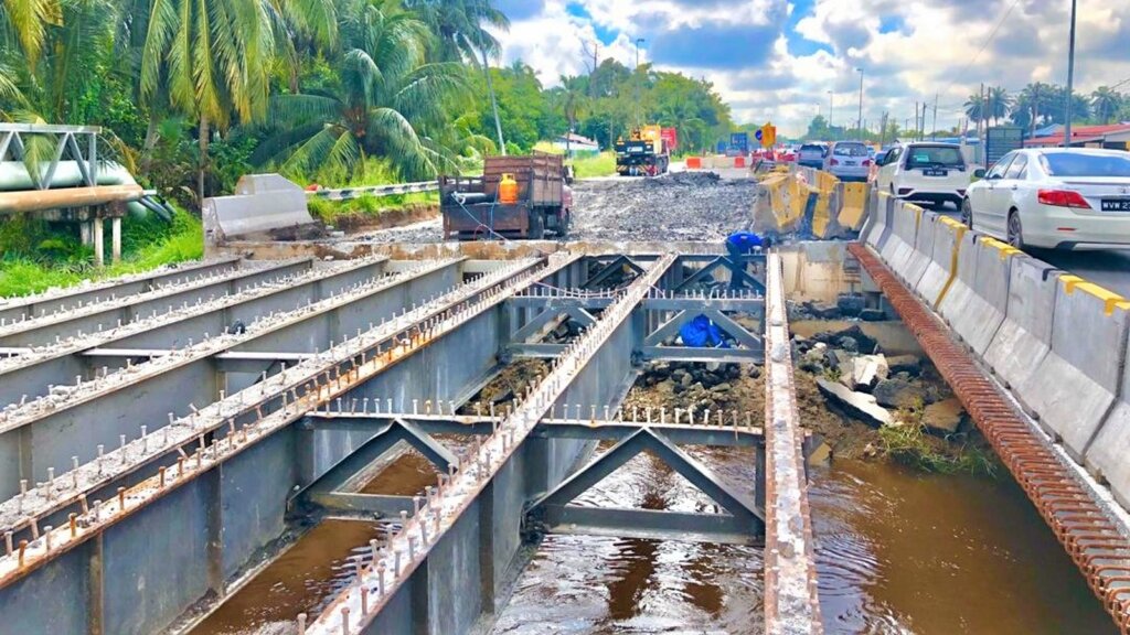 Demolition of the second half of the existing steel composite bridge.