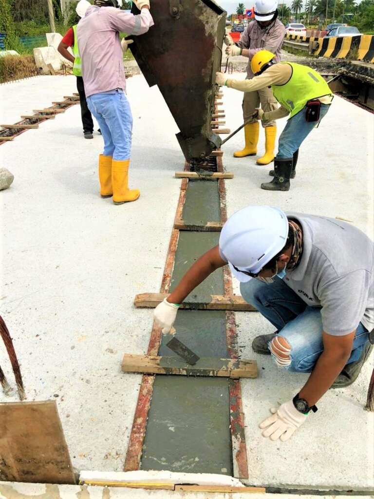 Laying of UHPC at the connection region of the precast beam