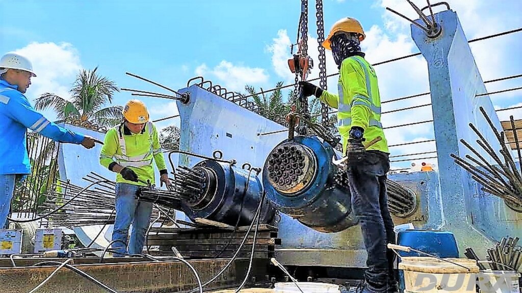 Post-tensioning work using two jack simultaneously in progress.