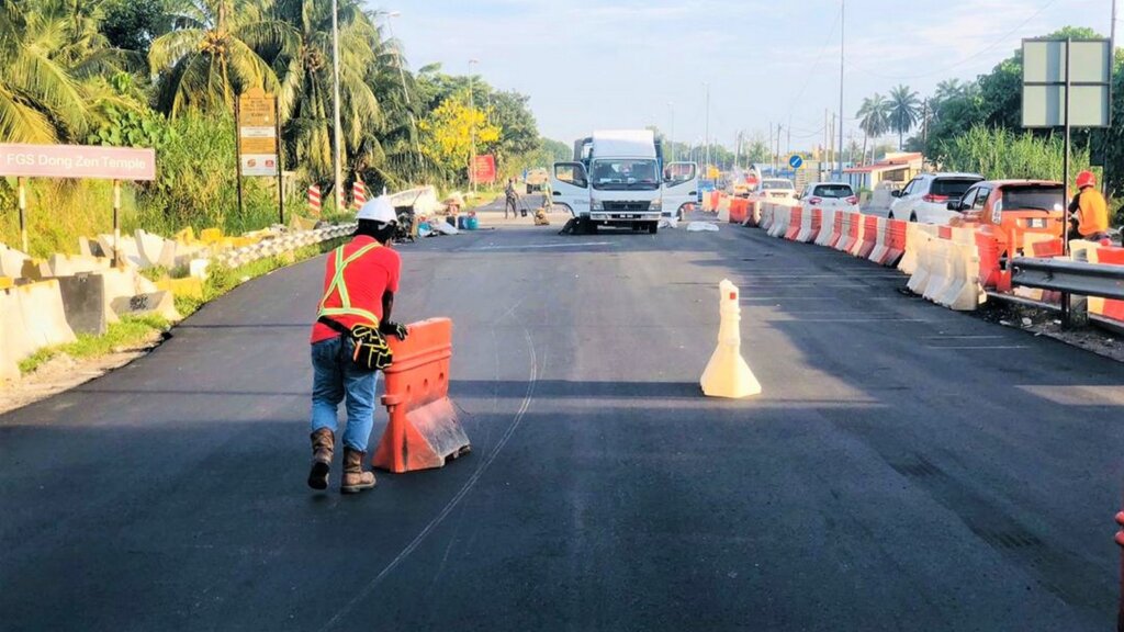 Second half of the new bridge premixed with wearing coarse.