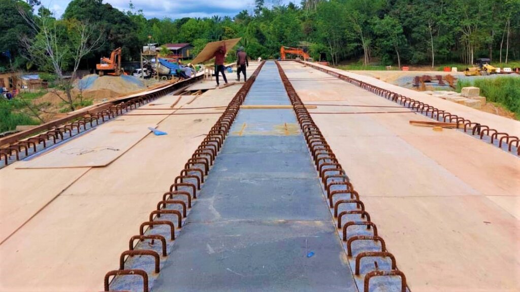 UHPC left-in form used between the U beams and timber formwork for inside U beams.