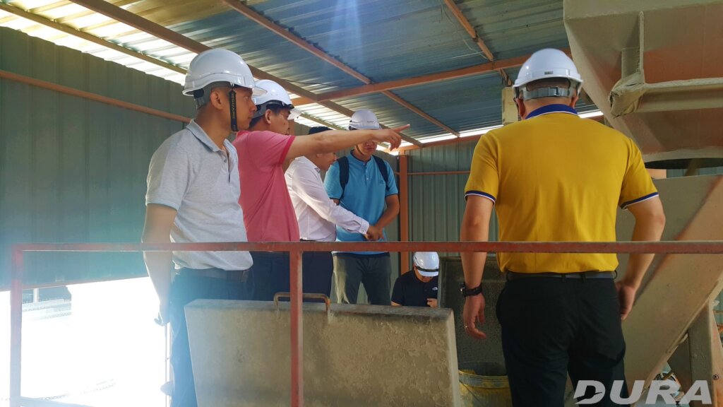 Distingushed guests witnessing the mxiing of UHPFRC.