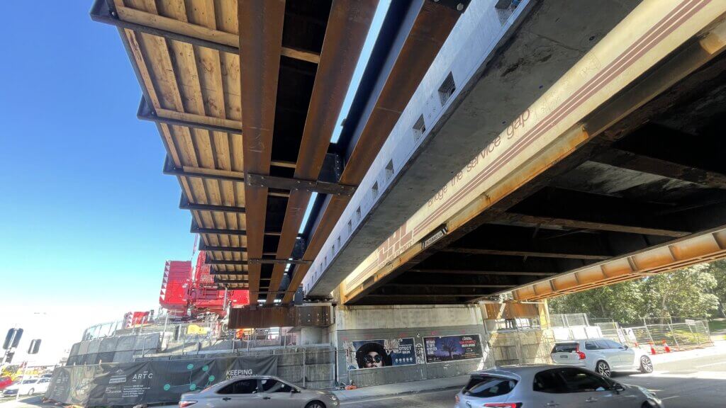 New precast prestress beam placed at the side of the existing steel bridge.
