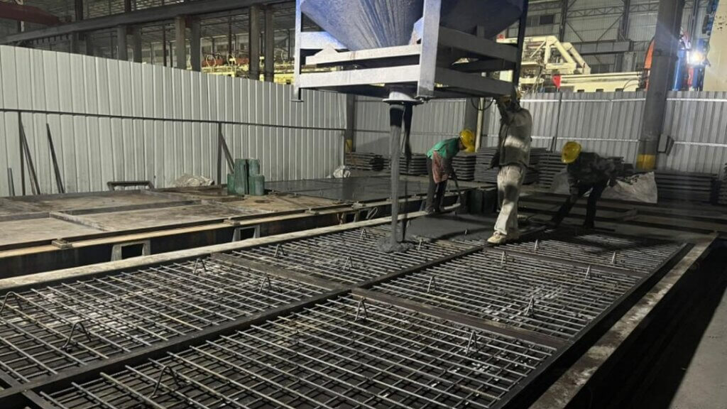 Casting of wall panel with UHPFRC.