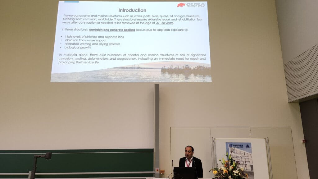 Dr Milad give presentation to audience.