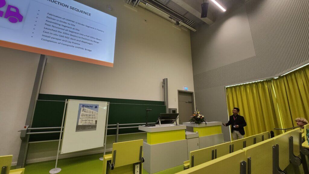 Ir Jhen Sen Tan give presentation to audience.