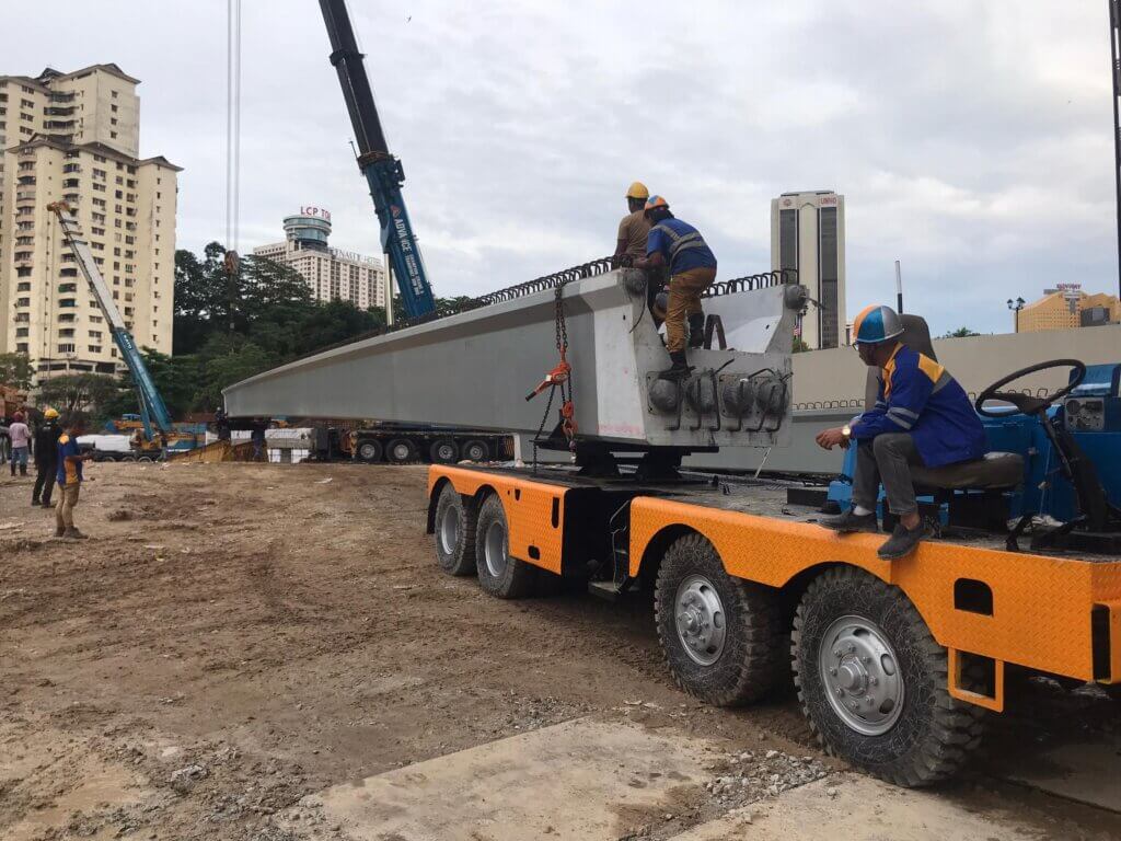 11.Deliver beam to launching site using trailer and crane.