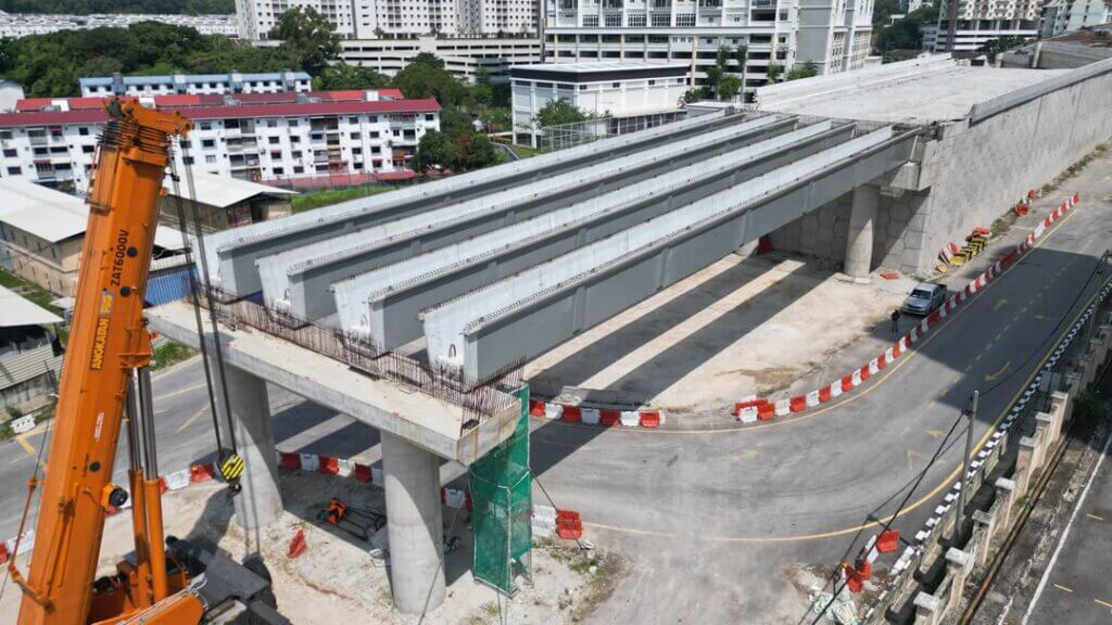 Installation of the precast UHPC bridge girders has been completed for this span. The girders have been positioned, aligned, and seated on the bridge bearings.