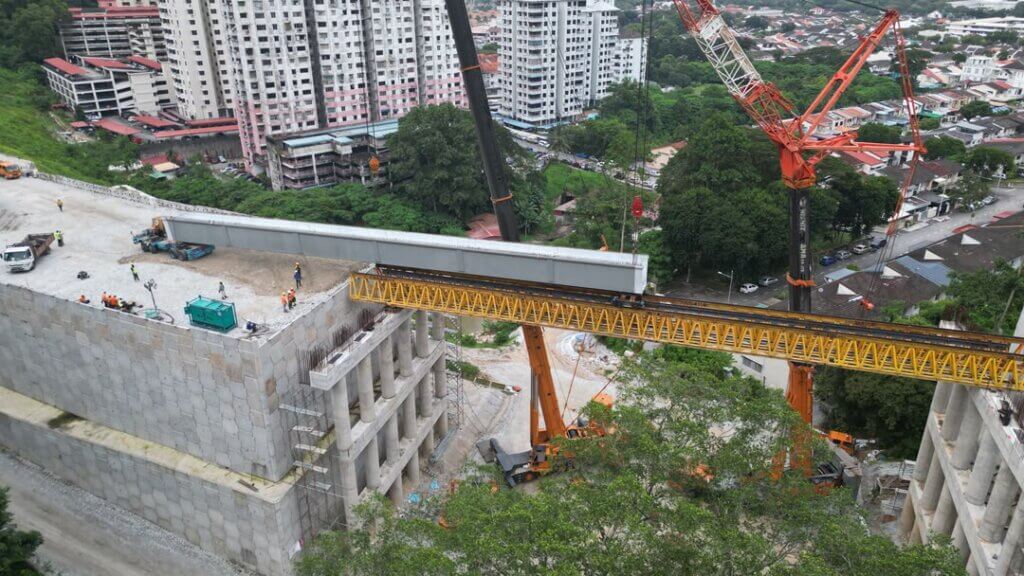 The launching girder is positioned across the span to support the ongoing precast beam erection.