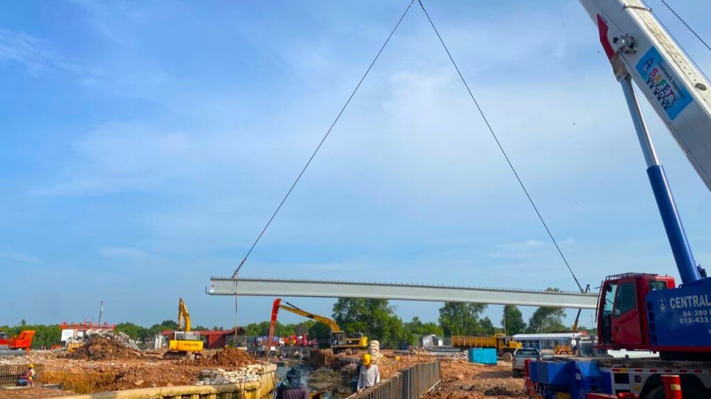 Beam launching is ongoing. Position and align the beam onto the abutments.
