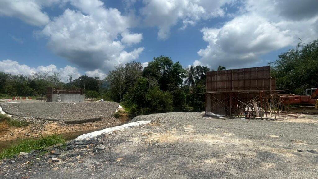 Abutment foundations and wing walls are under construction.
