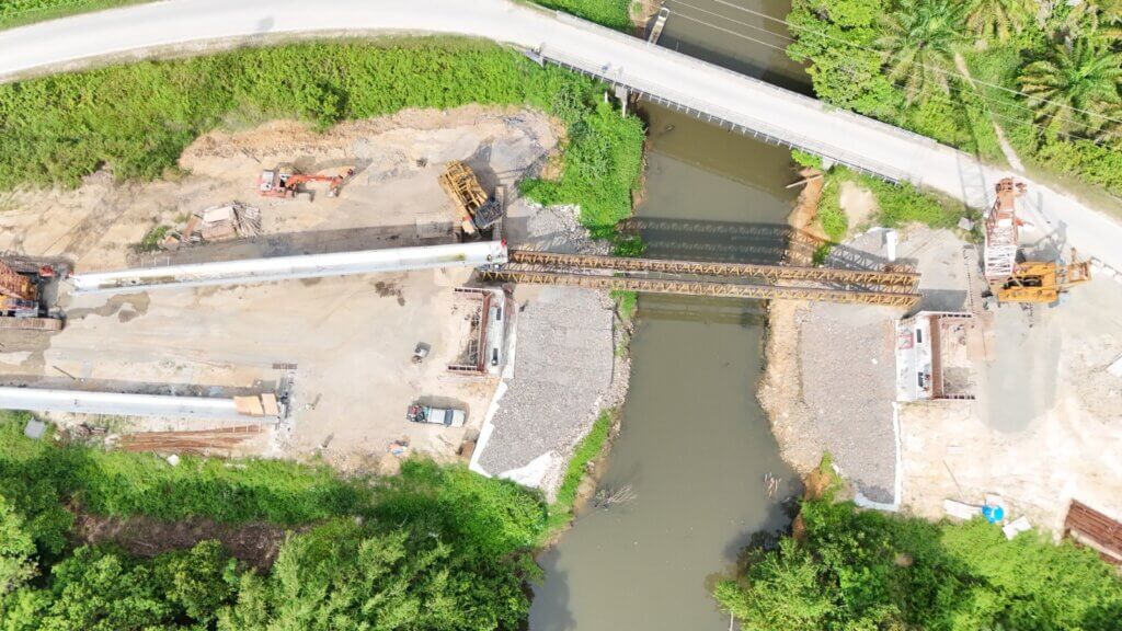 Commencement of beam hoisting for placement onto launching truss.