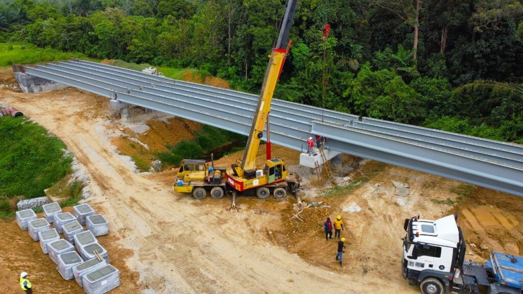 Bridge 1-Ongoing positioning of beams onto the abutments as part of the launching operation.