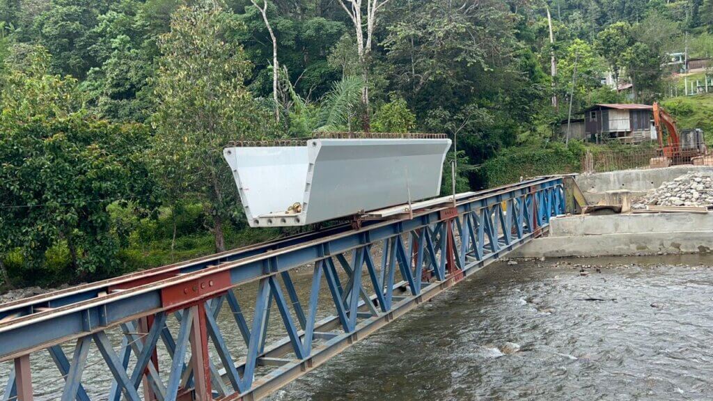 Beam segment being transported across a temporary launching gantry.