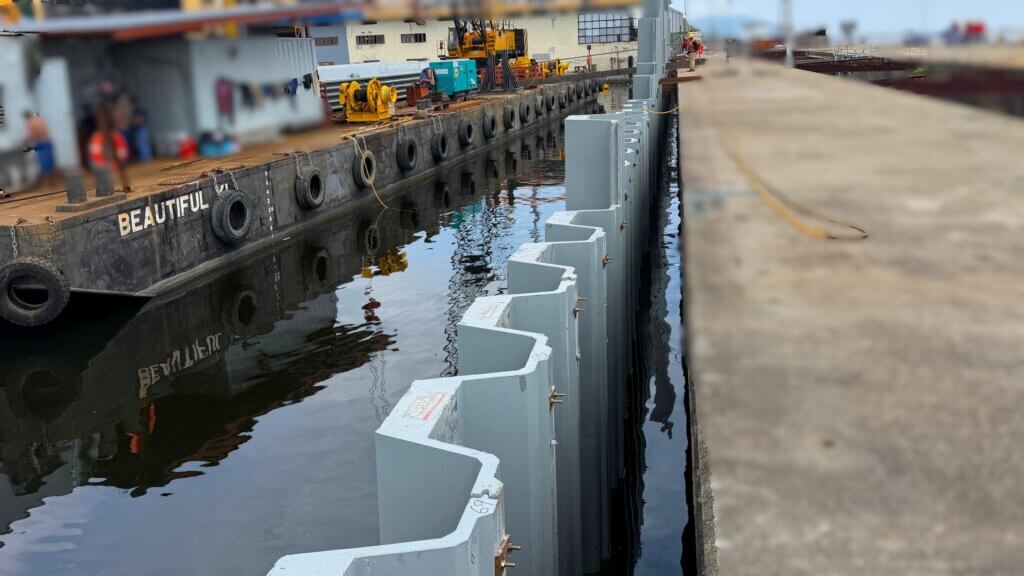 UHPFRC Prestressed sheet piles being installed into the seabed along the existing jetty.